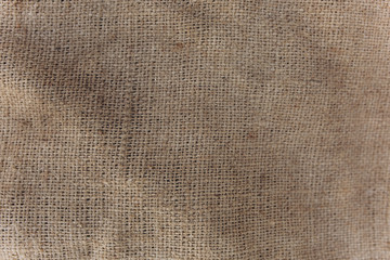 Old vintage linen cloth textile. Burlap rustic tumbled texture background.