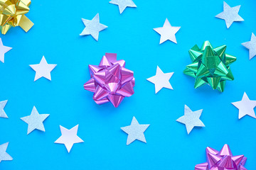 Golden star sprinkles on double pink and blue. Festive holiday background. Celebration concept. Top view, flat lay. Horizontal