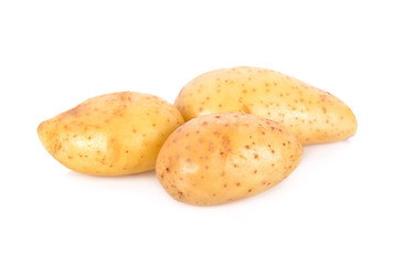 whole unpeeled fresh potatoes on white background