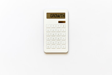 White powered solar calculator isolated on white background viewed from above in studio.
