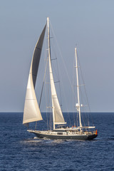 Fototapeta premium Sailboat sailing in the evening