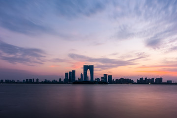 Obraz premium The River Sunset at The Gate of the Orient in Suzhou, China