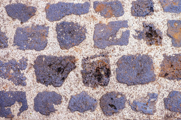 The pavement of granite stone, old cobblestone road texture, background.