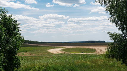 Fototapeta na wymiar Summer landscape with field and road