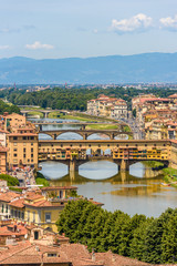 Fototapeta na wymiar View of Florence from Piazzale Michelangelo - River Arno with Ponte Vecchio and Palazzo Vecchio - Tuscany, Italy