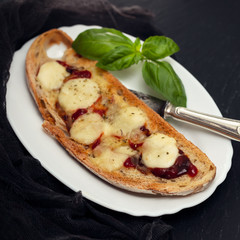 toast with sauce and cheese on white dish