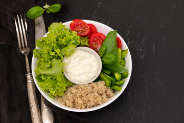 boiled quinoa with lettuce, pepper, tomato and sauce