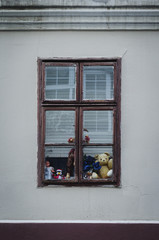 Toys in the old rustic window