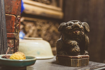 Wooden dog figurine in antique shop