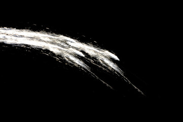 milk splash isolated on black background