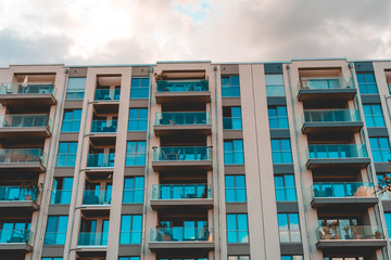 vintage colored picture of apartment building with glass balcony