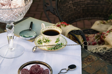 Garden Tea Party. Vintage Tea Cup with Lilies of the Valley. English Tea in Garden. Retro Style.