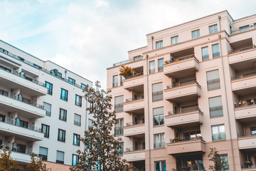 white and orange colored apartment buildings at berlin, west