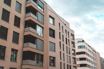 orange and white buildings on a cloudy day