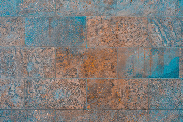 square marble facade in warm and cold colors