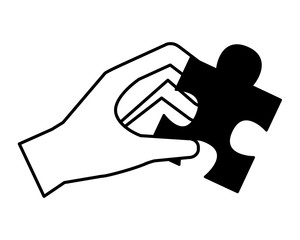 hand holding jigsaw puzzle piece work