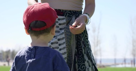 Toddler wearing baseball cap in summer - close up on  back of hat