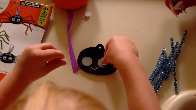 Video Of A Young Toddler Boy Making Spooky Halloween Crafts With His Mom At Their Living Room Table