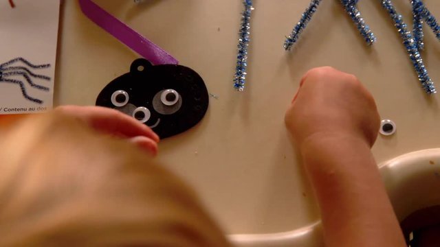 Video Of A Young Toddler Boy Making Spooky Halloween Crafts With His Mom At Their Living Room Table