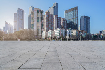 empty marble floor and cityscape of  in blue cloud sky