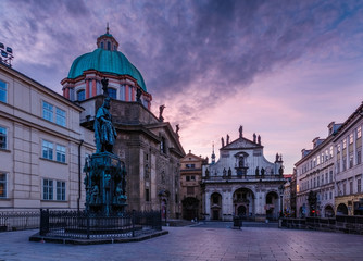 Fototapeta na wymiar Krizovnicke square at the morning. Golden hour in Prague with city gas lamps and Charles IV statue, Czech Republic