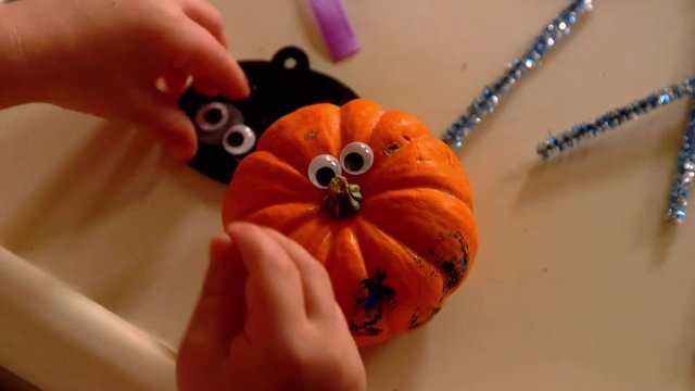 Video Of A Young Toddler Boy Making Spooky Halloween Crafts With His Mom At Their Living Room Table