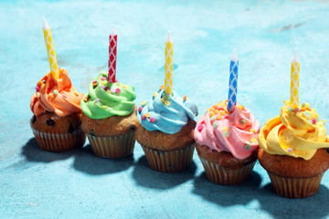 Tasty cupcakes on table. Birthday cupcake in rainbow colors.