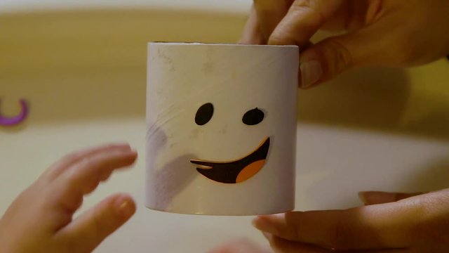 Video Of A Young Toddler Boy Making Spooky Halloween Crafts With His Mom At Their Living Room Table