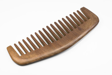 Wooden comb on white floor