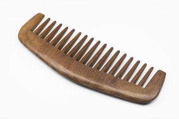 Wooden comb on white floor