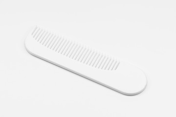 Wooden comb on white floor