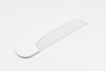 Wooden comb on white floor