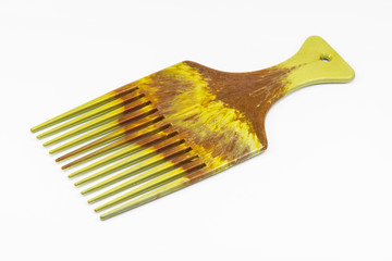 Wooden comb on white floor