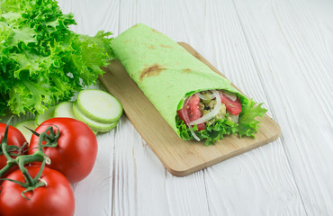 vegetarian shaverma from vegetables, on a wooden background