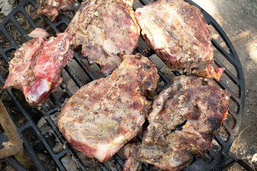Closeup of pork steaks on the BBQ