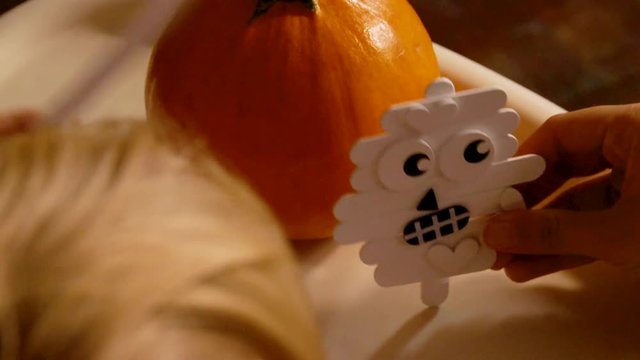 Video Of A Young Toddler Boy Making Spooky Halloween Crafts With His Mom At Their Living Room Table