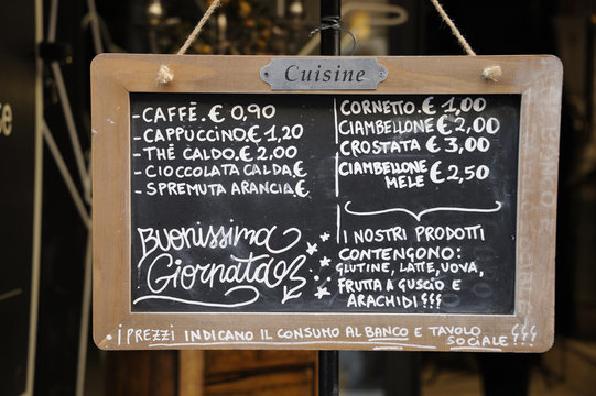 Outdoor restaurant menu sign in Italian