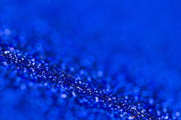 Blue glitter texture close up macro. Abstract sparkle background.