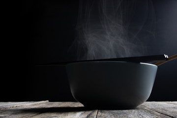hot food water steam in a bowl  with chopstick