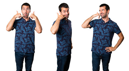 Obraz premium Set of Brunette man making phone gesture