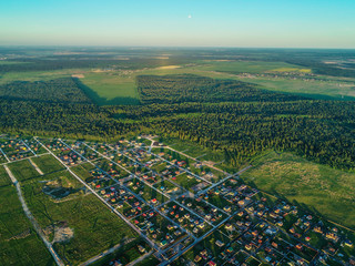 view from the height of the cottage village at sunset Russia