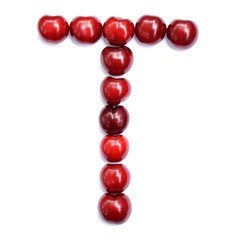 Letter T made with cherries to form a letter of the alphabet. Berry letters on a white background.