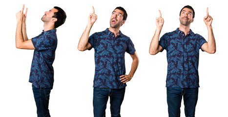 Obraz premium Set of Brunette man pointing up