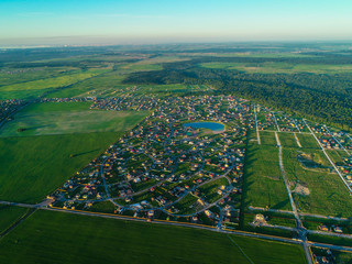 view from the height of the cottage village at sunset Russia