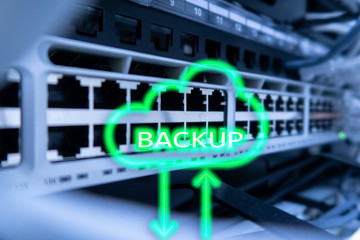 Backup button on modern server room background. Data loss prevention. System recovery.