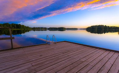 Naklejka na ściany i meble Summer night lake view from Sotkamo, Finland.