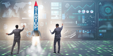 Start-up concept with rocket and businessman