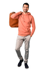 Full body of  Man in a pink sweatshirt holding a vintage briefcase on isolated white background