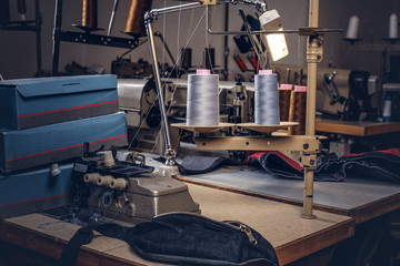 Picture of a tailor's desktop at the sewing workshop.