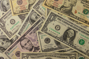 Background of different dollar banknotes